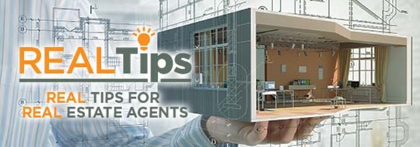 Person holding a condo with the REALtips logo